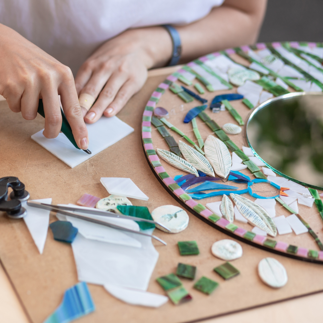 Student creating a mosaic | The Eclectic Chic Boutique