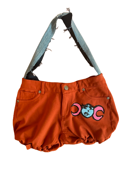 Upcycled pants into mini cute purse that is lightweight, durable and comfortable to carry