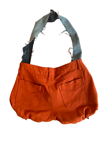 Upcycled mini cute purse from pants. This Product   is lightweight, durable and comfortable to carry. Symbolizes Womanhood Cycles throughout life.