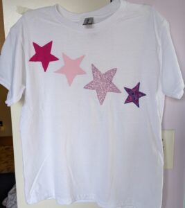 White tee with four pink stars