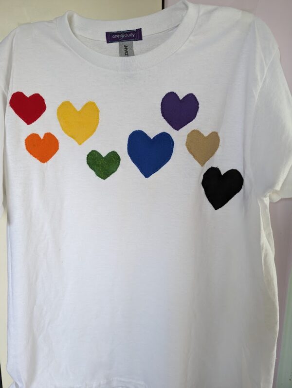 White t-shirt with hearts in gay pride colors