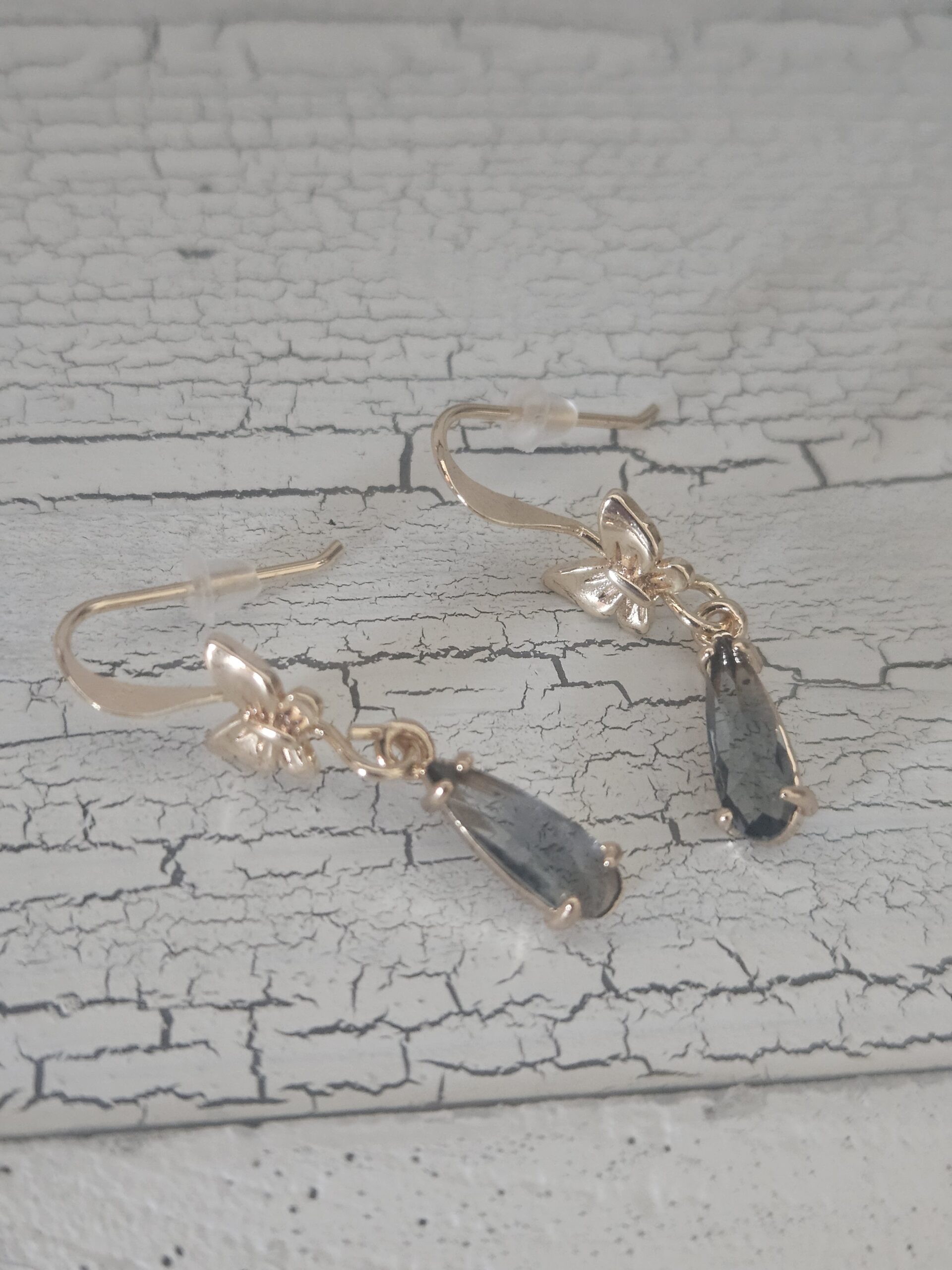 Gold bow drop earrings with smoky grey pendant 2