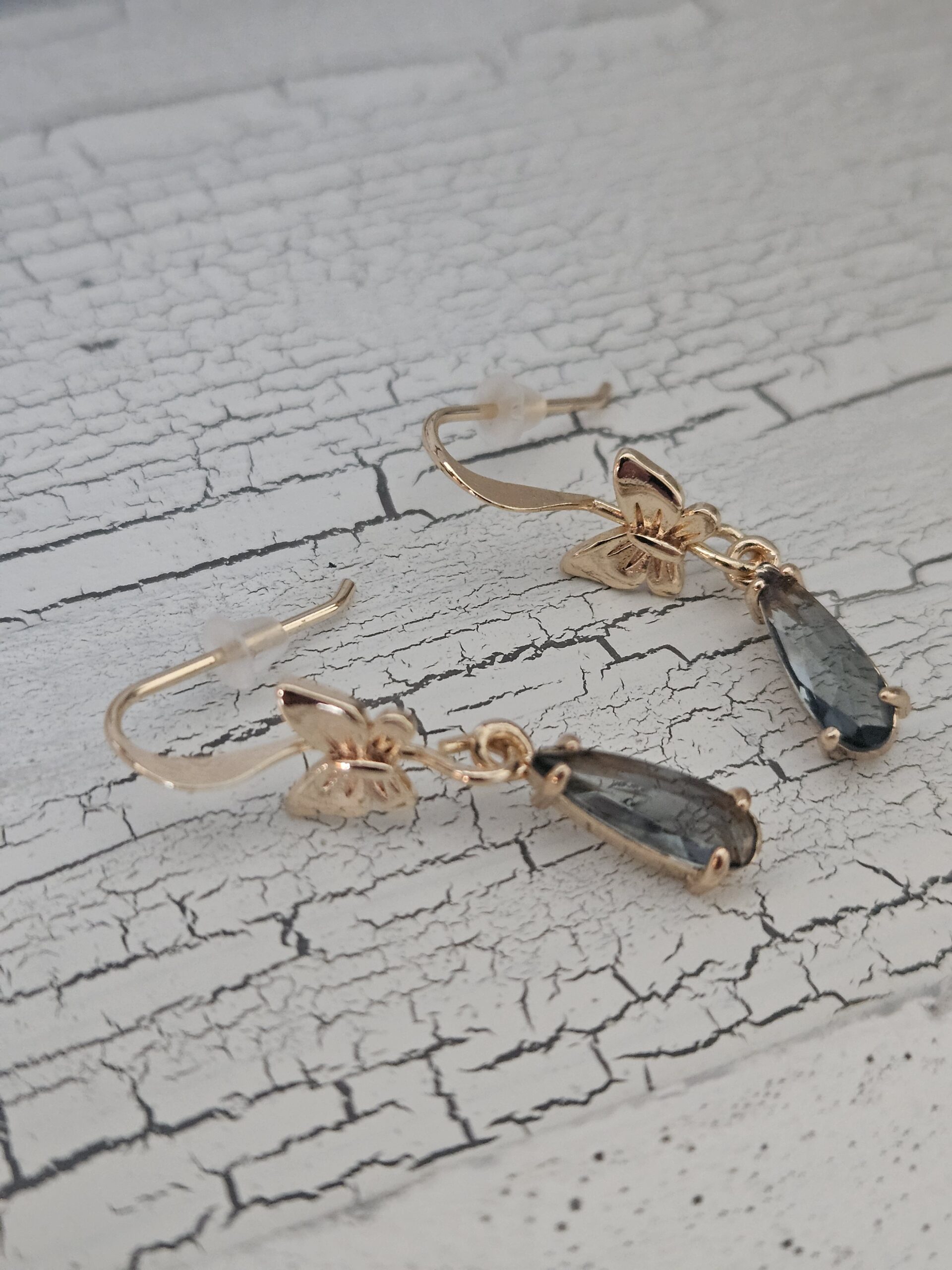 Gold bow drop earrings with smoky grey pendant 3