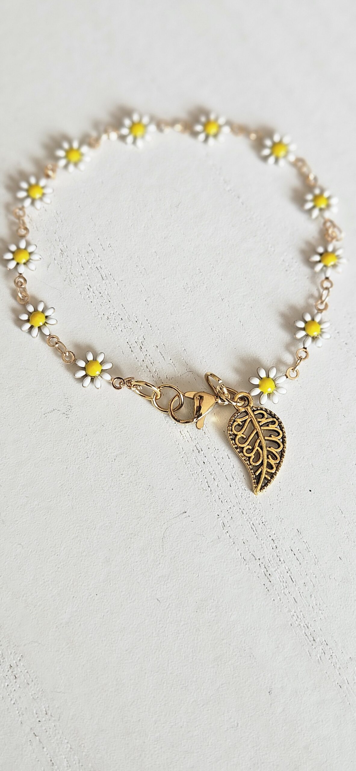 Gold Daisey Link and charm bracelet 1